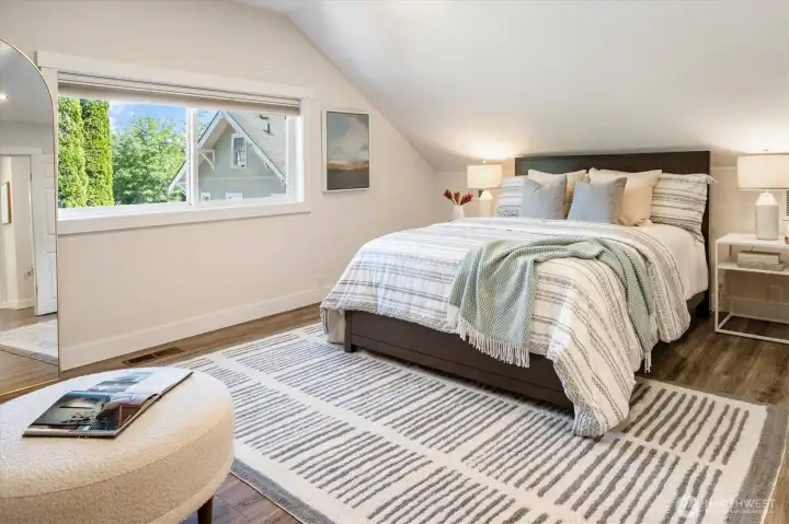Upstairs you will find a spacious primary bedroom with adjacent bathroom.