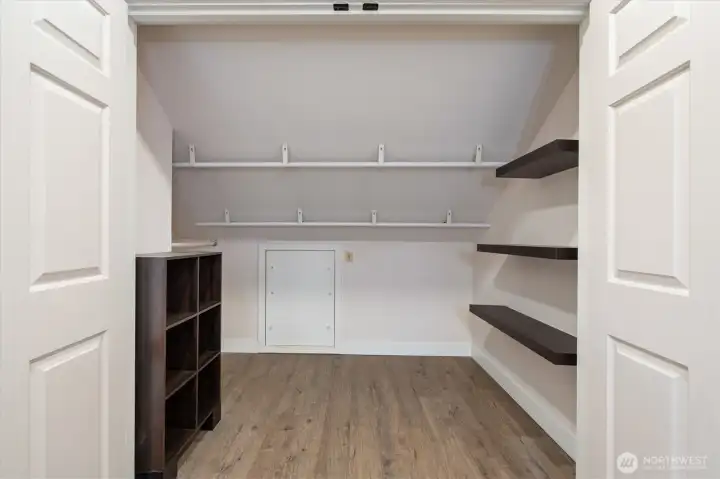 Between the bedroom and bathroom is a walk-in closet.
