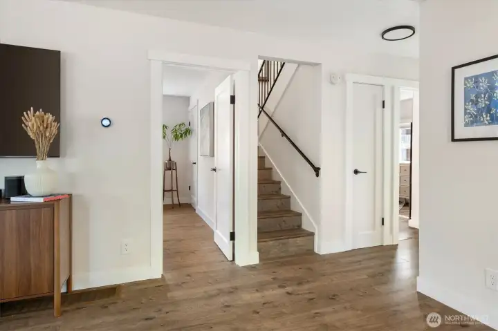 On the main floor, off from the living spaces feature two bedrooms and a bathroom.