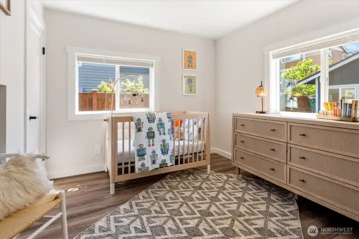 The back bedroom has been used as a nursery, but it's big enough to put your own stamp on this room.