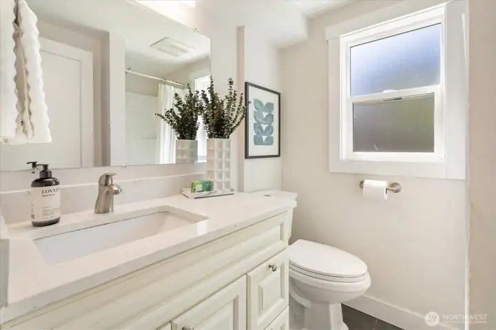 The main floor bathroom is next to the back bedroom.