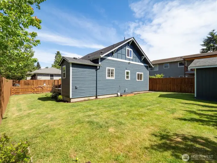 This wraparound yard is great to entertain, relax and also maintain with its level ground.