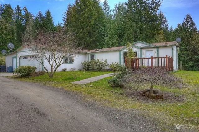Nestled in a forest and sitting atop of knoll, this 3-bedroom 2 bath home is your answer for country living.