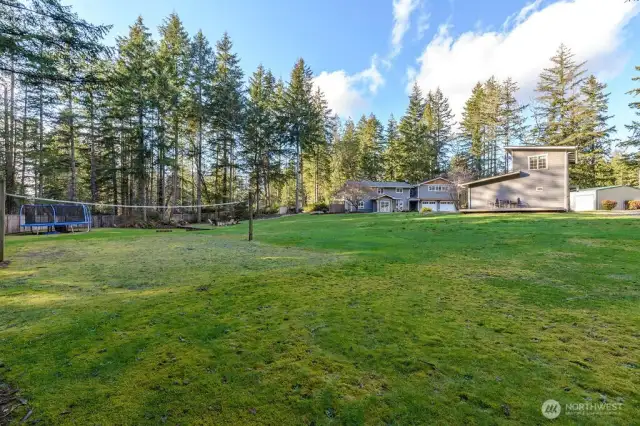 Large backyard with volleyball court, trampoline, horseshoe court, wood burning fire pit and stadium lighting!  Additionally, DADU with deck off the side