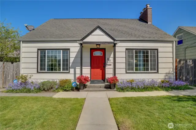 This updated classic 1950s 4-bedroom includes a full bath on both floos, 2-car garage   in the fenced back yard, and a basement.