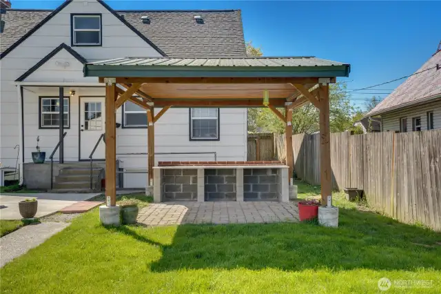 Open the back kitchen door to head out to the newly poured patio and the covered paver patio. Set up a buffet under the covered patio when it's summer cookout time.