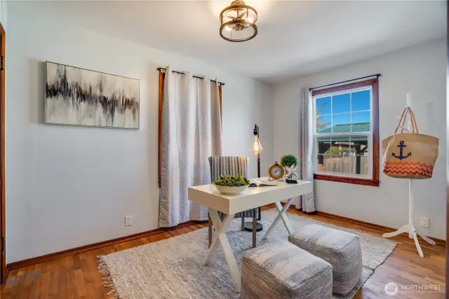 The 2nd main floor bedroom is set in the NW corner of the house with a window to the back yard.