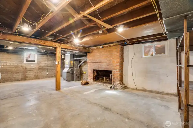 The 2nd fireplace is a fun surprise, and the 2023 gas furnace is just a few feet beyond.