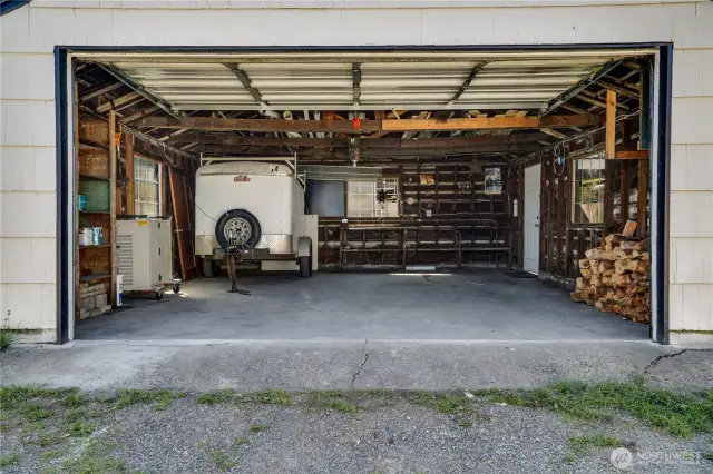 The 2-car detached garage with an automatic door opens to the alley on the north side of the lot.