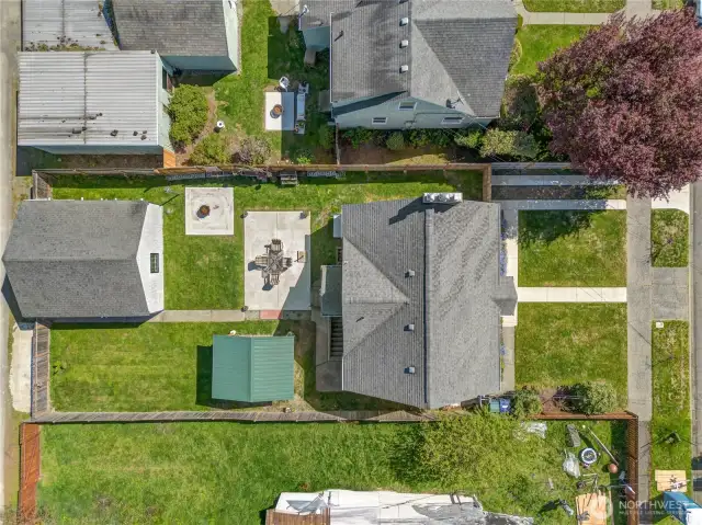 This 1,484 sq ft home is set on a 5,850 sq ft lot with new fencing installed in 2019. Notice the paved driveway area in front with a path connecting it to the front porch.