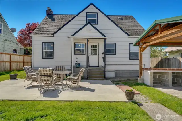 A 2019 fence fully enclosed the back yard with its multiple patios, a hot tub pad, and a detached garage.