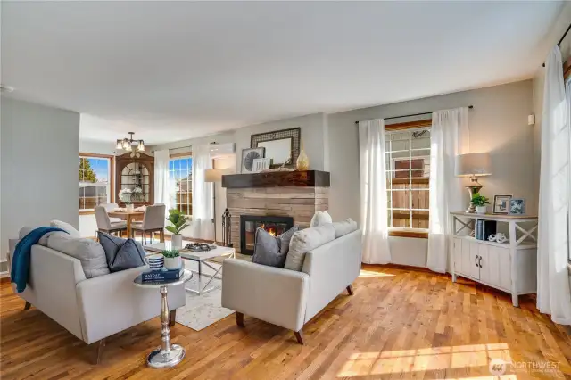 Now that you've seen a few highlights, we'll start right here at the front door. A south window catches the sunlight to brighten the living room.