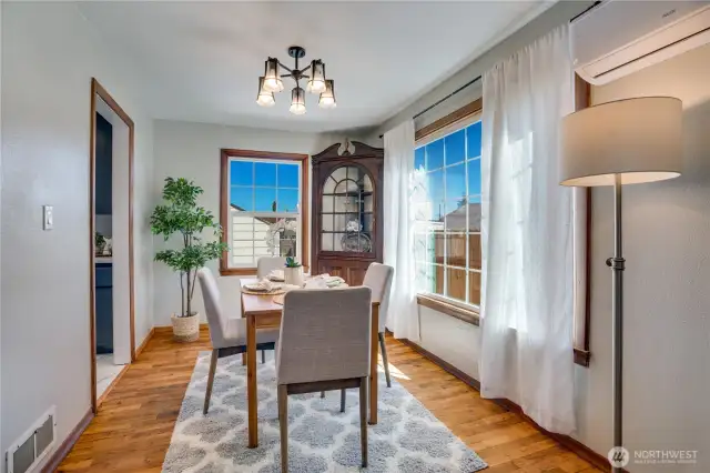 Hardwoods continue into the dining area with its doorway to the kitchen.