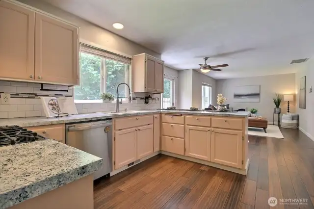 Spacious kitchen with ample cabinetry, is open to the nook and familyroom- perfect for everyday meals and hosting.