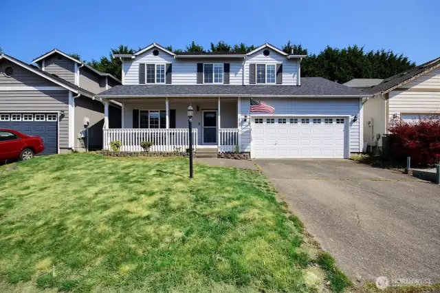 The 2 car garage features custom built-in storage shelves, that stay!