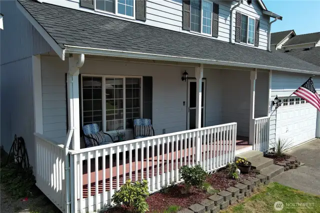 Inviting covered front porch – a perfect spot to sip your morning coffee or unwind and enjoy the sunset in the evening.