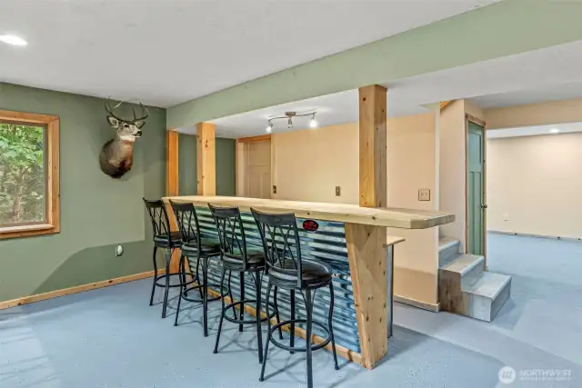 Downstairs: Man cave - she cave - gaming area or living room