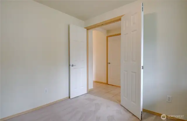 Office/Den with french doors looking into entry hallway