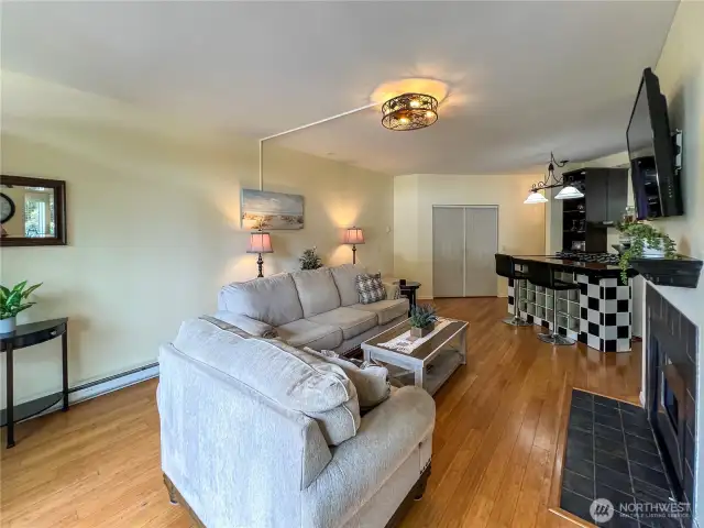 Nicely updated with bamboo flooring, fireplace and bar area which will be great for entertaining.