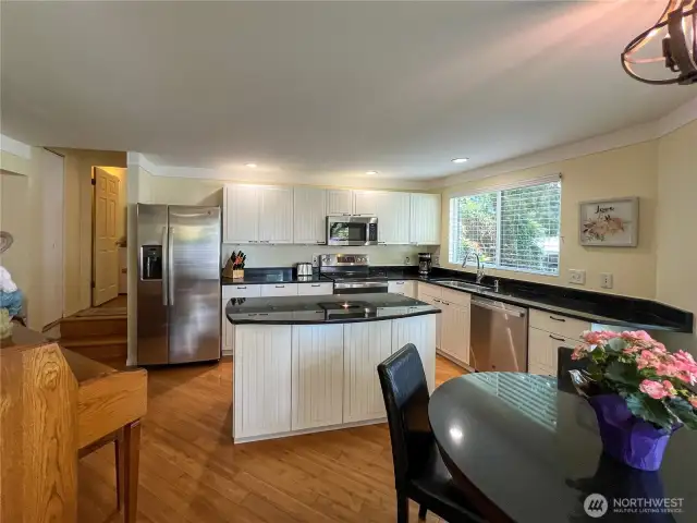 Updated kitchen with newer cabinets, granite counters and appliances. Also, a nice eat in kitchen with area.