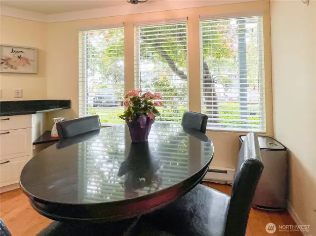 Eating area with nice windows to bring the light in.