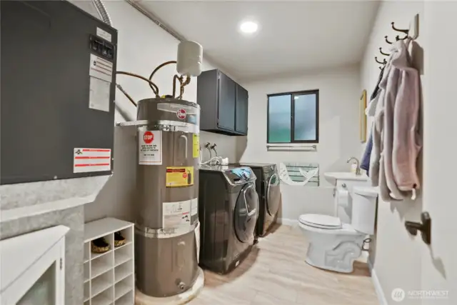 1/2 bath, laundry & utility area between the 'rec' room and 4th bedroom/garage.