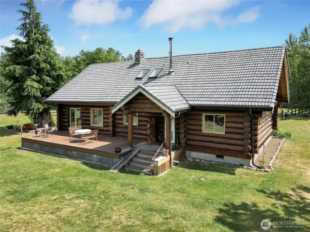 The well-maintained rustic log home is served by a private well (a rare and now almost-impossible-to-permit amenity in King County).