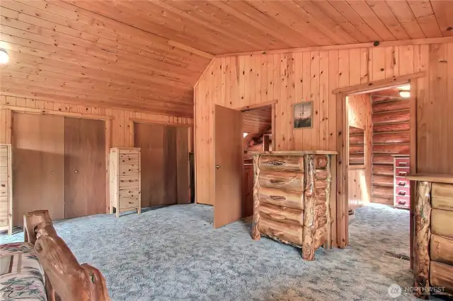 Primary bedroom looking towards bathroom. Convenient 2nd laundry in closet behind door.