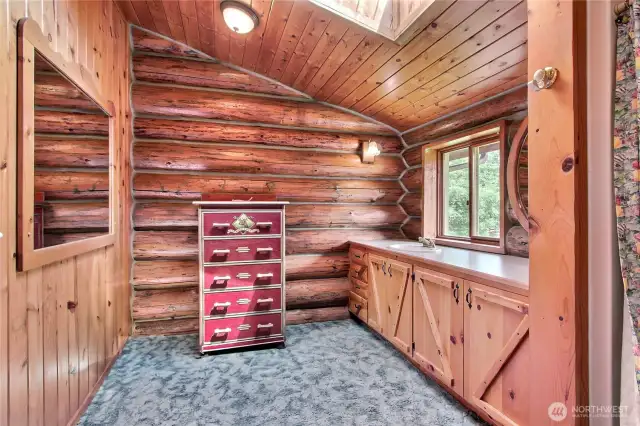 Primary bath with large shower and pocket door.