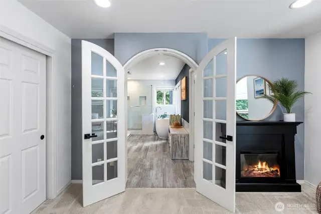 French doors lead to the spa-like bath