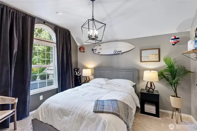 2nd bedroom suite with vaulted ceilings and private full-bathroom