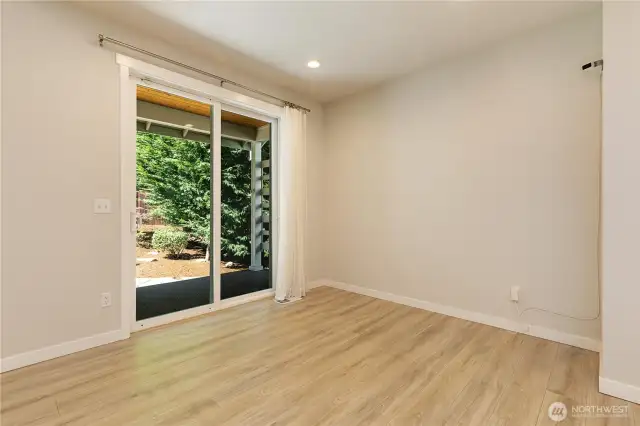 Slider to covered patio and beautifully landscaped yard