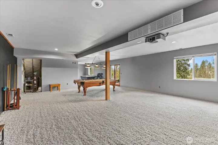 How will you utilize this enormous, 45' x 20' space? Will it become a game/media area for all ages? What about the possibility of an MIL? It does have French doors that exit to the backyard and an unfinished bathroom you'll see in another photo. The current owners were planning a new, luxury primary bedroom suite
