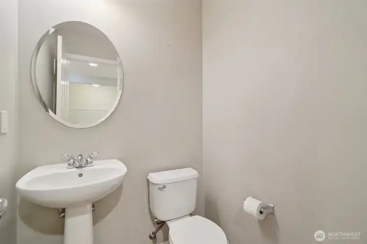 Powder room next to garage
