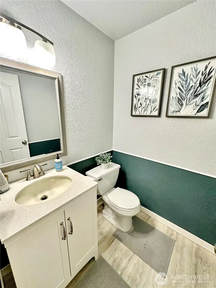 Charming, updated powder room on main floor.