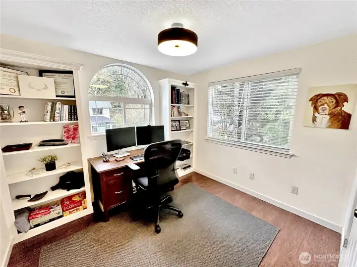 4th bedroom currently used as an office. Charming arched window, built in bookcases and closet.