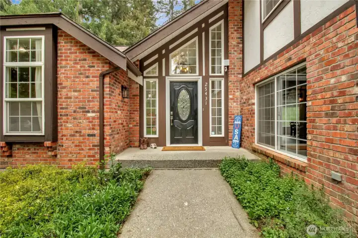 Enter from the double car garage or the welcoming front porch.