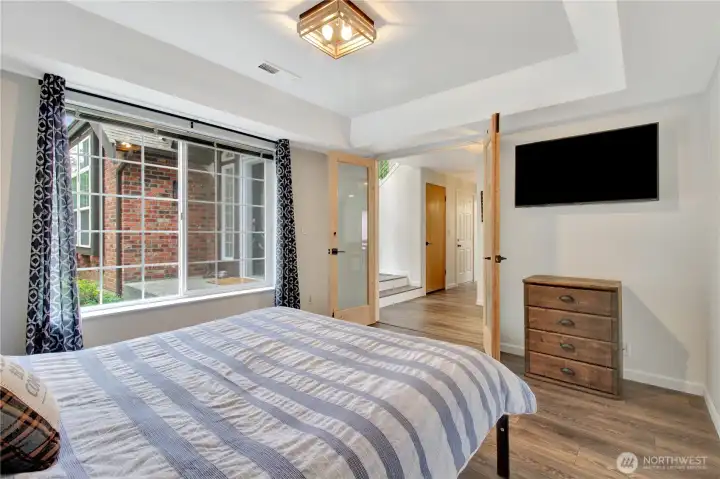 This flex room overlooks the front gardens with french doors to the main living areas