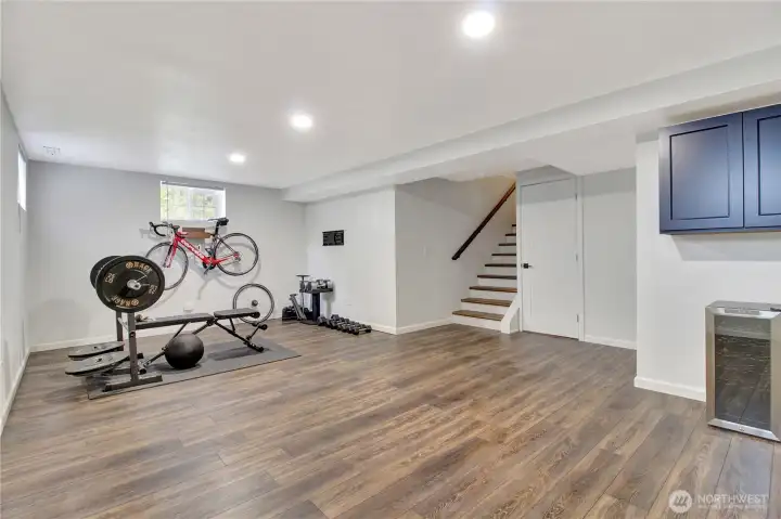 One large finished room in the basement with high ceilings and plenty of space.