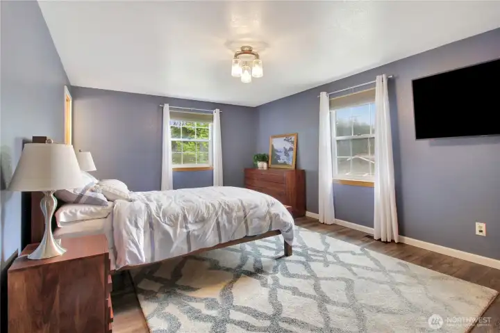 Main bedroom overlooks backyard.