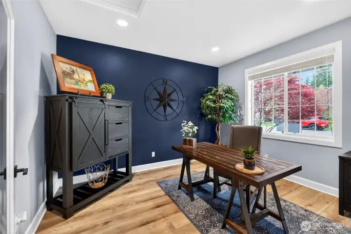Front office space with single glass panel door, perfect for teleworking or using as a homeschool room!
