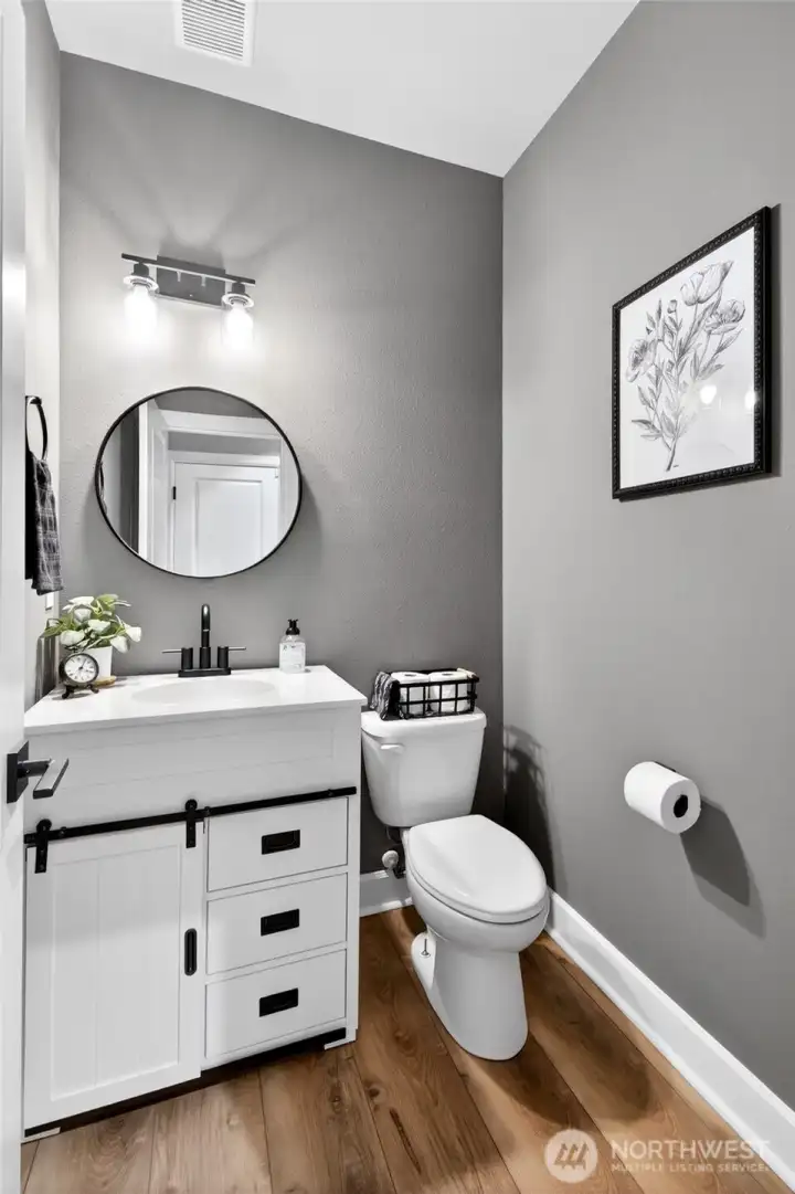 Half bath conveniently located immediately upon entry from the garage. Light is motion activated.