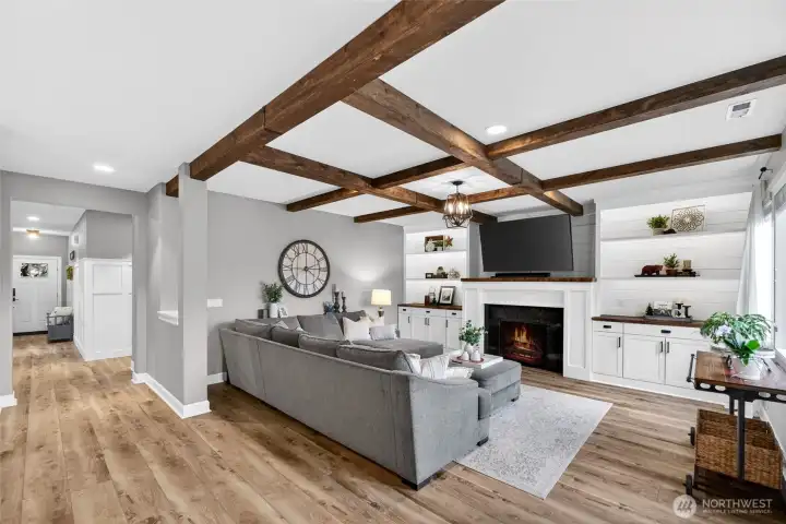 Small peak-a-boo partition wall helps define this living space and offers a great ledge for plants or decor!