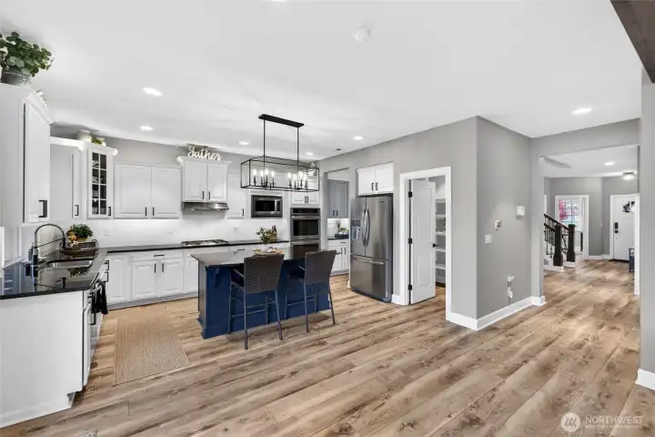 Stunning kitchen with lots of space between kitchen and living room for potential 2nd dining room table.