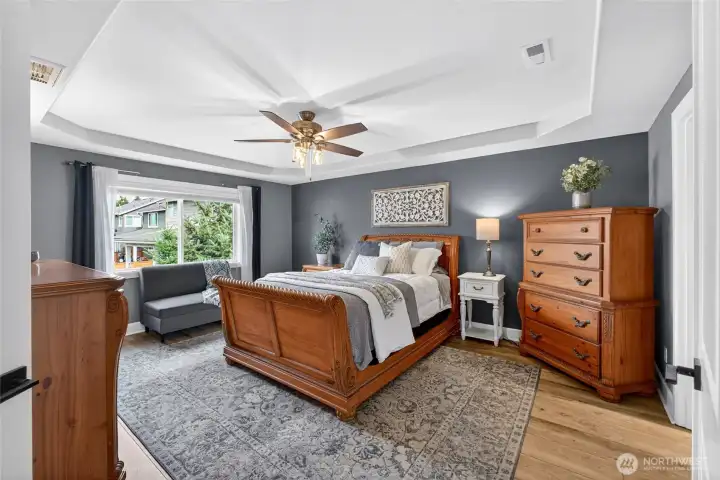 Beautiful primary bedroom with double door entry.
