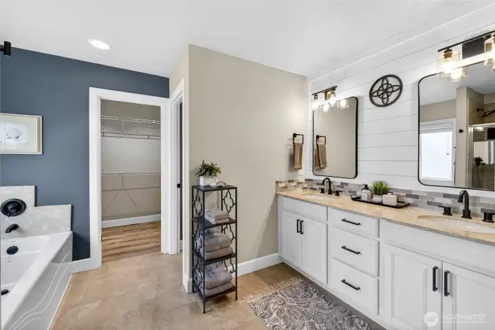 5-piece primary ensuite bathroom! Two sinks, separate toilet room, walk-in shower and soaking tub perfect for relaxing at the end of the day.