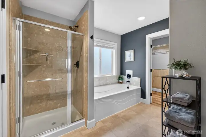 Shower features built in shelves! Frosted window with blinds above bath for complete and total privacy.