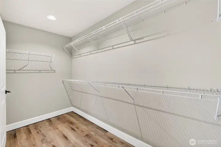 Primary walk-in closet extends in both directions! Light is motion activated.