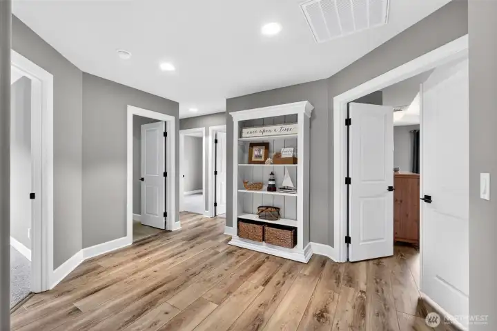 Generous upstairs landing space between bedrooms perfect for decor displays, storage cabinets, or a cozy reading spot! This landing also features a linen closet not pictured.