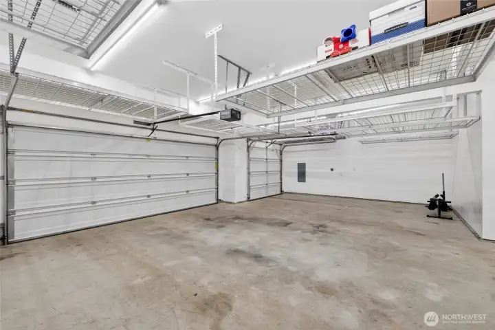 THREE CAR GARAGE + 9 OVERHEAD STORAGE RACKS INCLUDED